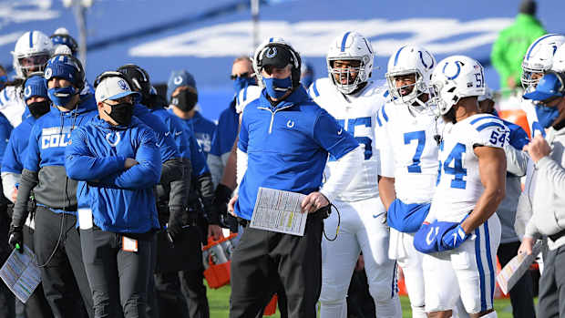 Indianapolis Colts head coach Frank Reich (holding play card) looks on from the Bills Stadium sidelines during Saturday's 27-24 AFC Wild Card Playoff loss to the Buffalo Bills.